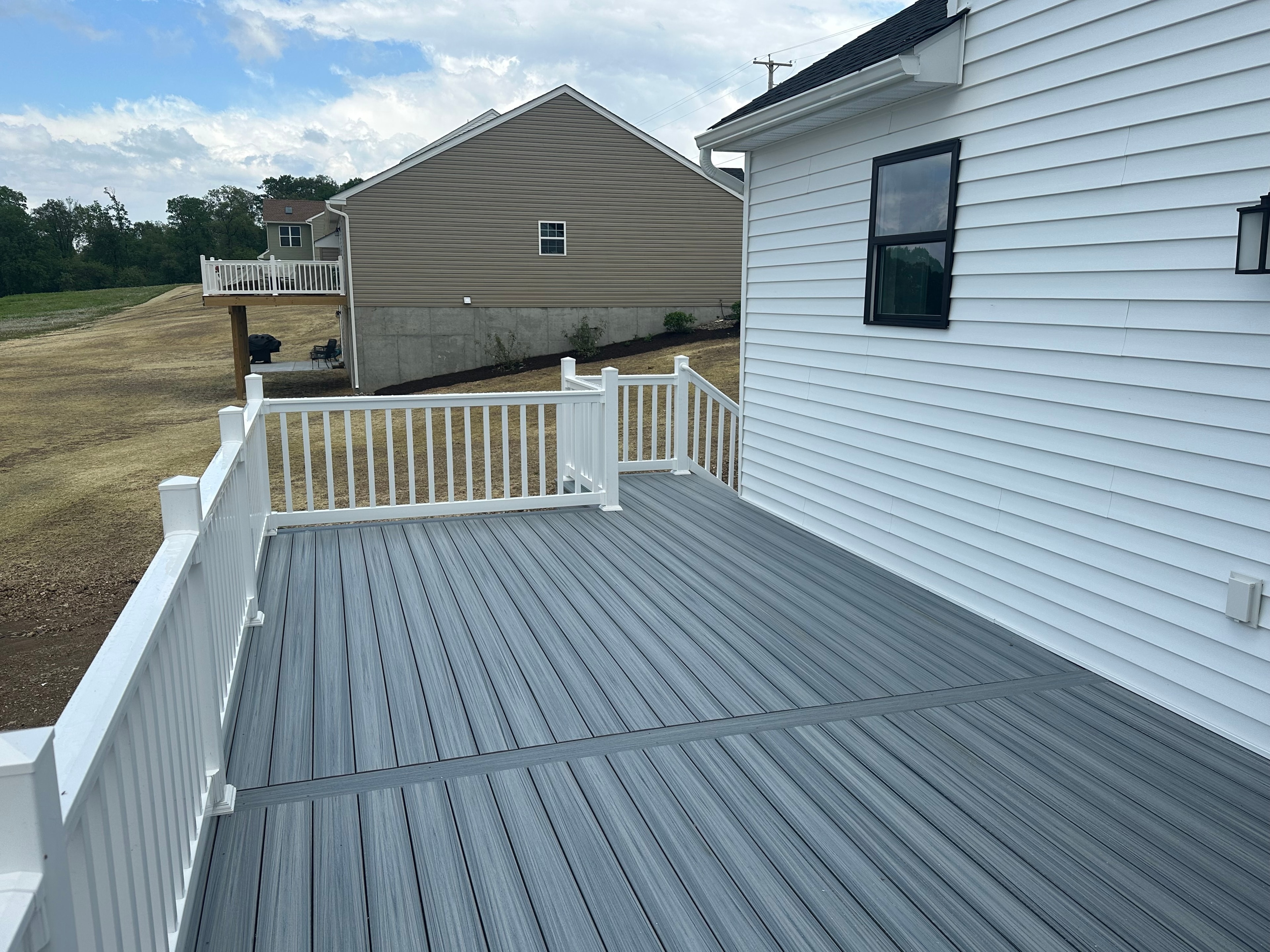 Gray composite deck surface and railings